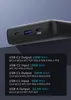 A close-up view of the ports on a black power bank, with text describing its charging capabilities. Produktbild-Vorschau