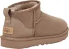 A side view of a single brown UGG boot. Produktbild-Vorschau