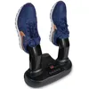 A black electric shoe dryer with two blue sneakers on it. Produktbild-Vorschau