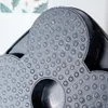 A close-up view of the textured surface of a black frying pan with a speckled granite coating. Náhľad obrázku produktu