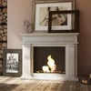 A modern white bioethanol fireplace is set in a living room with decorative items and a stack of logs. Produktbild-Vorschau