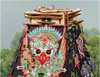A close-up view of a wooden puzzle model of a pyramid with intricate, colorful artwork depicting a mythical creature. Náhľad obrázku produktu