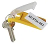 A key with a yellow key tag and a clear plastic cover, with a white label attached. Produktbild-Vorschau