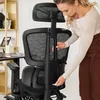 A woman is adjusting an ergonomic office chair. Produktbild-Vorschau