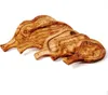 Three wooden cutting boards shaped like steaks are arranged diagonally on a white background. Produktbild-Vorschau