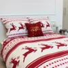 A Christmas-themed duvet cover and pillow set with reindeer and snowflake patterns. Podgląd zdjęcia produktu