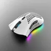 A white gaming mouse with honeycomb design and RGB lighting is shown on a gray surface. Produktbild-Vorschau