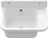 A white sink with a drain and a ribbed area on the right side, mounted on a white wall. Anteprima dell’immagine prodotto