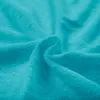 A close-up shot of turquoise terry cloth fabric. Náhled obrázku produktu