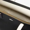 Close-up view of the interior of a black and white shopper bag. Produktbild-Vorschau