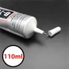 A close-up shot of a tube of B-7000 adhesive glue with its cap removed. Anteprima dell’immagine prodotto