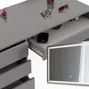 A close-up view of a gray vanity table with drawers and a mirror with LED lighting. Produktbild-Vorschau