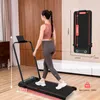 A woman is using a treadmill in a room. Produktbild-Vorschau