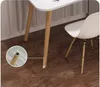 Close-up of a desk leg and a chair leg on a wooden floor. Produktbild-Vorschau