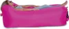 A woman is relaxing on a pink inflatable lounger. Produktbild-Vorschau