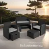 A rattan furniture set is arranged on a patio overlooking the ocean at sunset. Náhled obrázku produktu