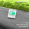 Close-up of the back of a rug, showing the texture and a label. Anteprima dell’immagine prodotto
