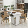 A kitchen setting with a white folding dining table and chairs. Voir les images du produit
