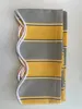 A folded awning valance with stripes is laid flat on a light gray surface. Produktbild-Vorschau