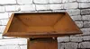 A close-up shot of a rusty metal planter on a stand against a brick wall. Produktbild-Vorschau
