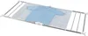 A light blue sweater is laid out on a mesh drying rack over a bathtub. Anteprima dell’immagine prodotto