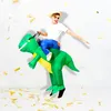 A person wearing an inflatable dinosaur costume, jumping with confetti falling. Náhled obrázku produktu