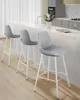 Three gray bar stools with white legs are lined up at a kitchen island. Náhled obrázku produktu