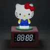 A Hello Kitty digital alarm clock with a night light function, set against a dark background. Podgląd zdjęcia produktu