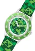 A close-up, angled view of a green Minecraft-themed watch against a white background. Náhled obrázku produktu