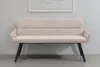 A beige upholstered bench with black legs is shown against a light gray wall. Produktbild-Vorschau