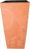 A tall, square planter with a marbled orange and white exterior and a black inner liner. Voir les images du produit