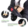 A close-up view of a baby's feet in a stroller footmuff, with text overlays highlighting features. Produktbild-Vorschau