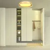 A modern entryway with a built-in closet and shelving unit, featuring a ceiling light. Náhled obrázku produktu