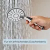 A hand holding a showerhead under running water. Produktbild-Vorschau