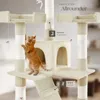 A cat playing on a multi-level cat tree with hanging toys. Voir les images du produit