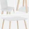 Collage of close-up shots of a white children's table and chair set with wooden legs. Anteprima dell’immagine prodotto