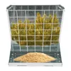 A metal hay feeder filled with yellow hay and a pile of feed at the bottom. Podgląd zdjęcia produktu