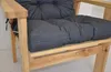 A close-up view of a grey cushion on a wooden chair. Produktbild-Vorschau