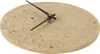A close-up, top-down view of a minimalist wall clock with a stone-like texture and dark hands. Produktbild-Vorschau