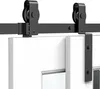 A close-up view of a black sliding barn door track system mounted above two white doors. Produktbild-Vorschau