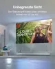 A projector is projecting a movie onto a large screen in a modern living room setting. The projector is placed on a stand, and the image shows the projector's adjustable angle. Produktbild-Vorschau