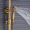 A close-up of a vintage-style brass showerhead and faucet with water spraying from the showerhead. Náhled obrázku produktu