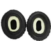 Two black headphone ear pads with white foam inserts are shown against a white background. Podgląd zdjęcia produktu
