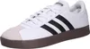 A white Adidas sneaker with black stripes and a brown sole. Anteprima dell’immagine prodotto
