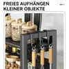 A close-up view of a kitchen organizer with jars and utensils, with German text overlay. Produktbild-Vorschau