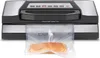 A vacuum sealer machine with a piece of salmon in a vacuum bag. Anteprima dell’immagine prodotto