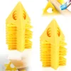 Stacks of yellow triangular painting pyramids for drying painted items. Produktbild-Vorschau