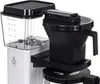 Close-up of a coffee maker's water reservoir and filter basket. Produktbild-Vorschau