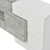 A close-up view of a modern TV cabinet with a gray textured drawer partially pulled out and a white high-gloss finish. Produktbild-Vorschau