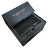 A black box with the lid open, revealing a black electronic device inside. Produktbild-Vorschau